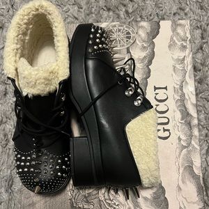 Spiked Gucci boots with fur